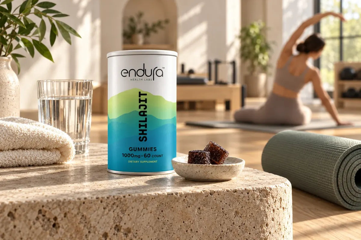 Endura tin and gummies beside a Pilates mat and towel